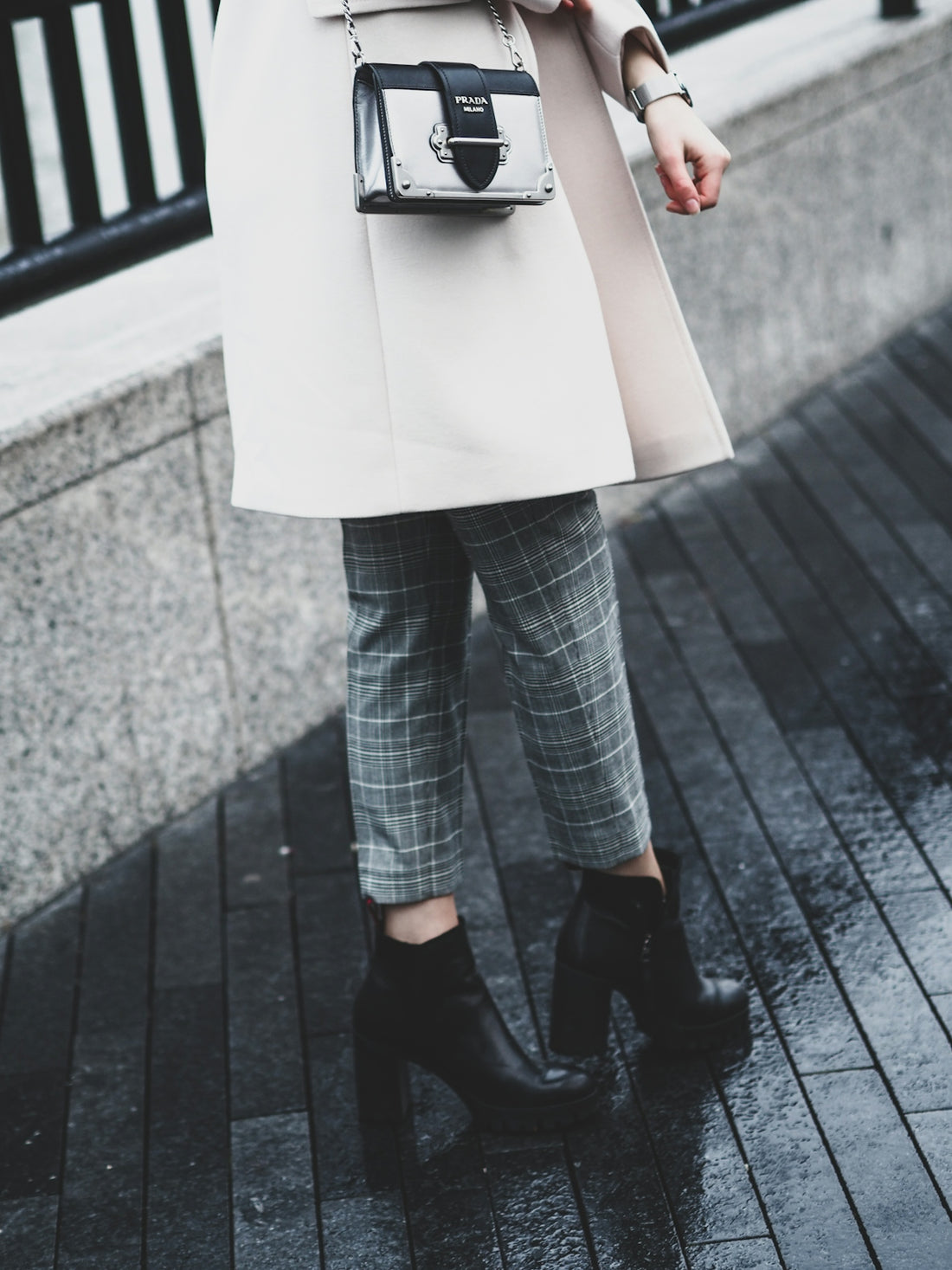 woman in blue denim jeans and black leather shoes