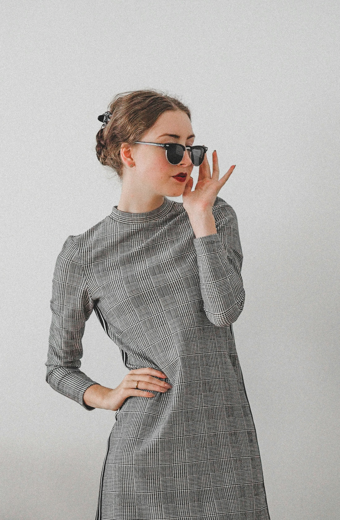 woman in black and white long sleeve dress wearing black sunglasses