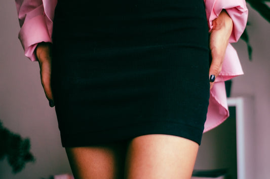 a close up of a person wearing a skirt