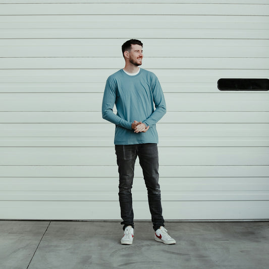 a man standing in front of a garage door