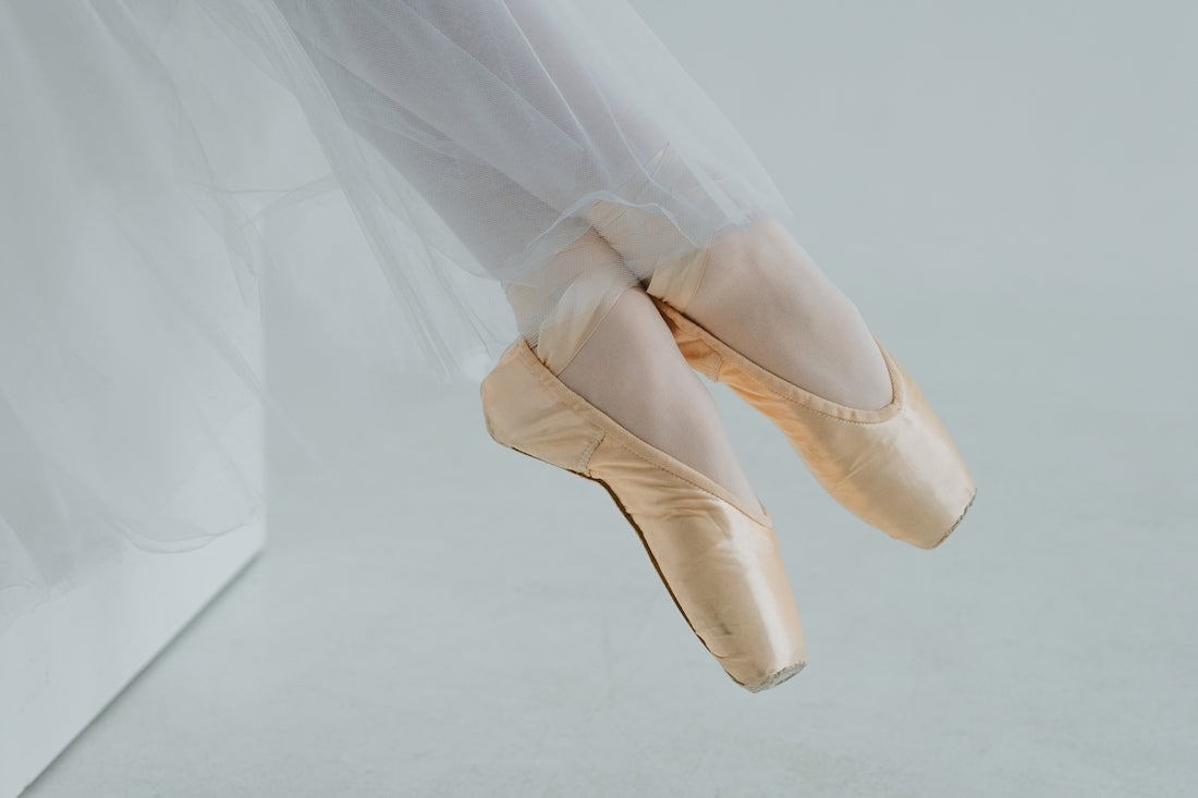 a ballerina's feet in a ballet shoe
