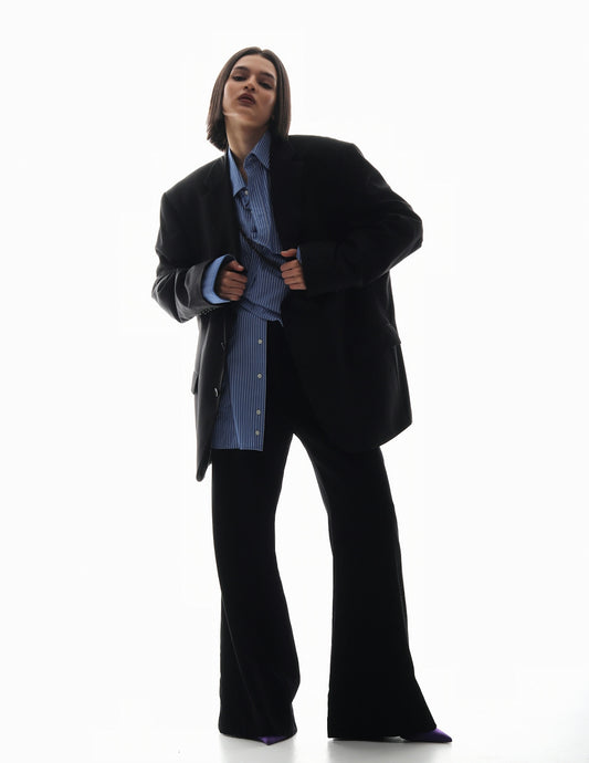 a man in a suit is posing for a picture
