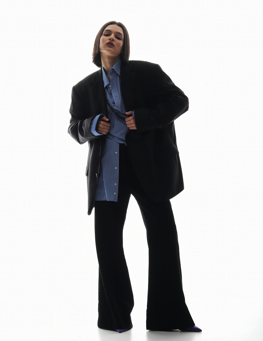 a man in a suit is posing for a picture